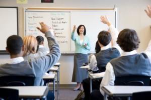 Teacher with hands raised